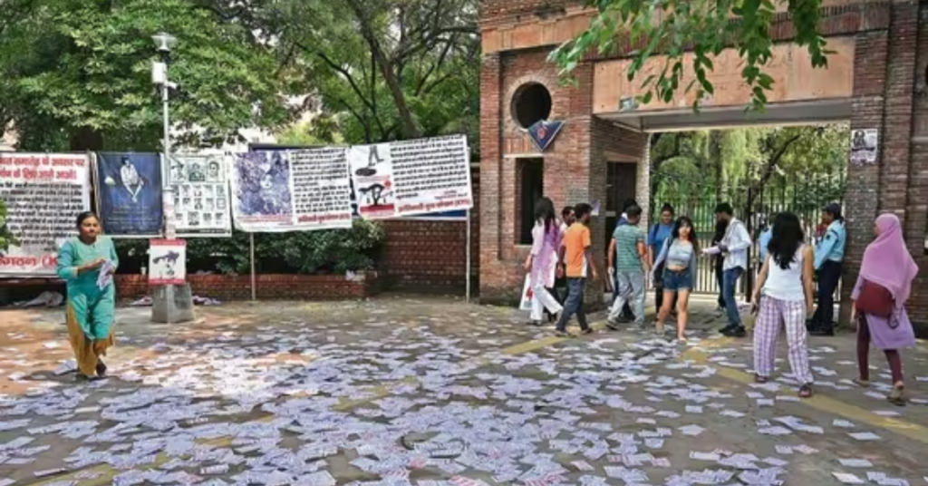 Students outside Kirori Mal College, Delhi University, with campaign pamphlets scattered on the ground after ABVP-NSUI clash ahead of DUSU elections