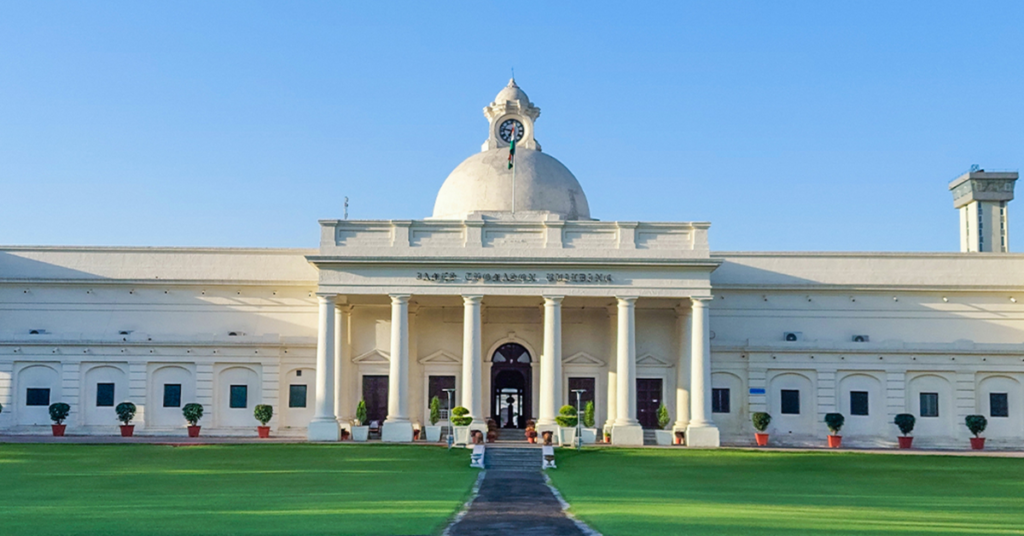 Front view of IIT Roorkee main building with clock tower and lawn
